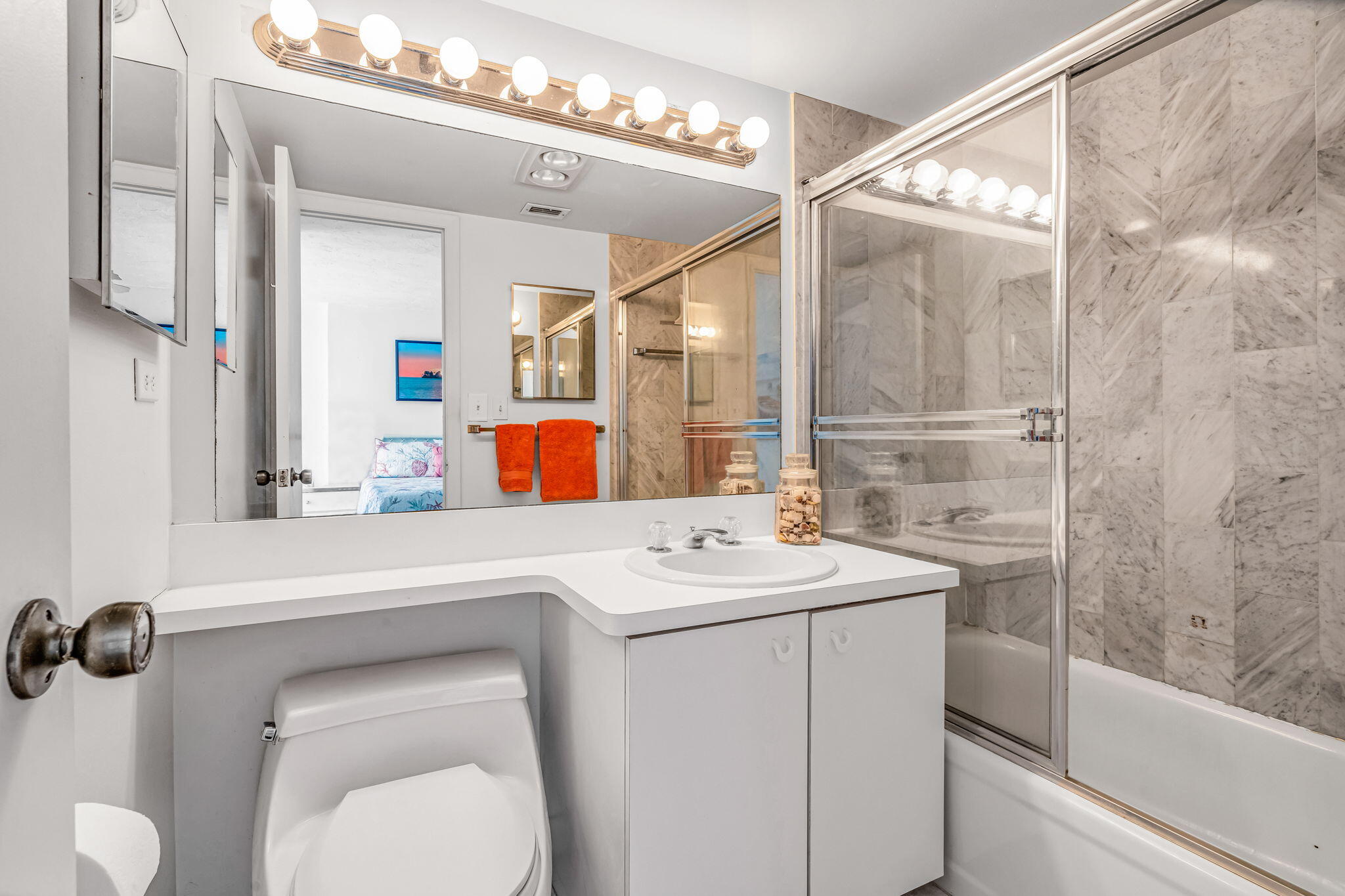 2000 Coco Plum Drive, Unit 1202 Marathon, FL 33050 - Photo 23 of 44 a bathroom with a sink a toilet and shower