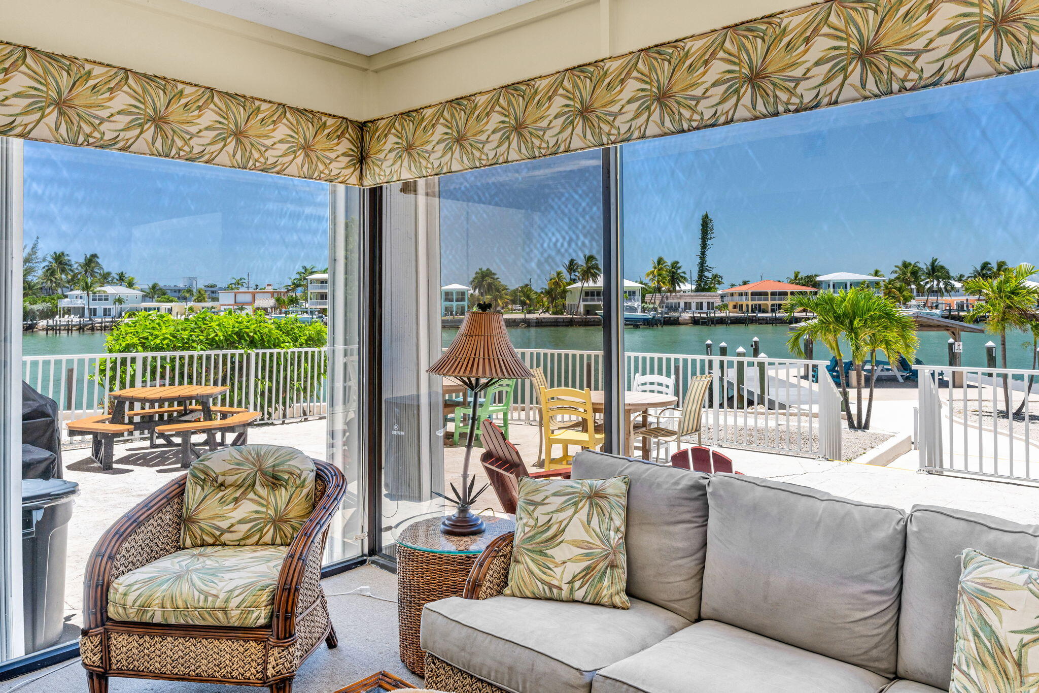 2000 Coco Plum Drive, Unit 1202 Marathon, FL 33050 - Photo 30 of 44 a view of a patio with couches chairs and a potted plant