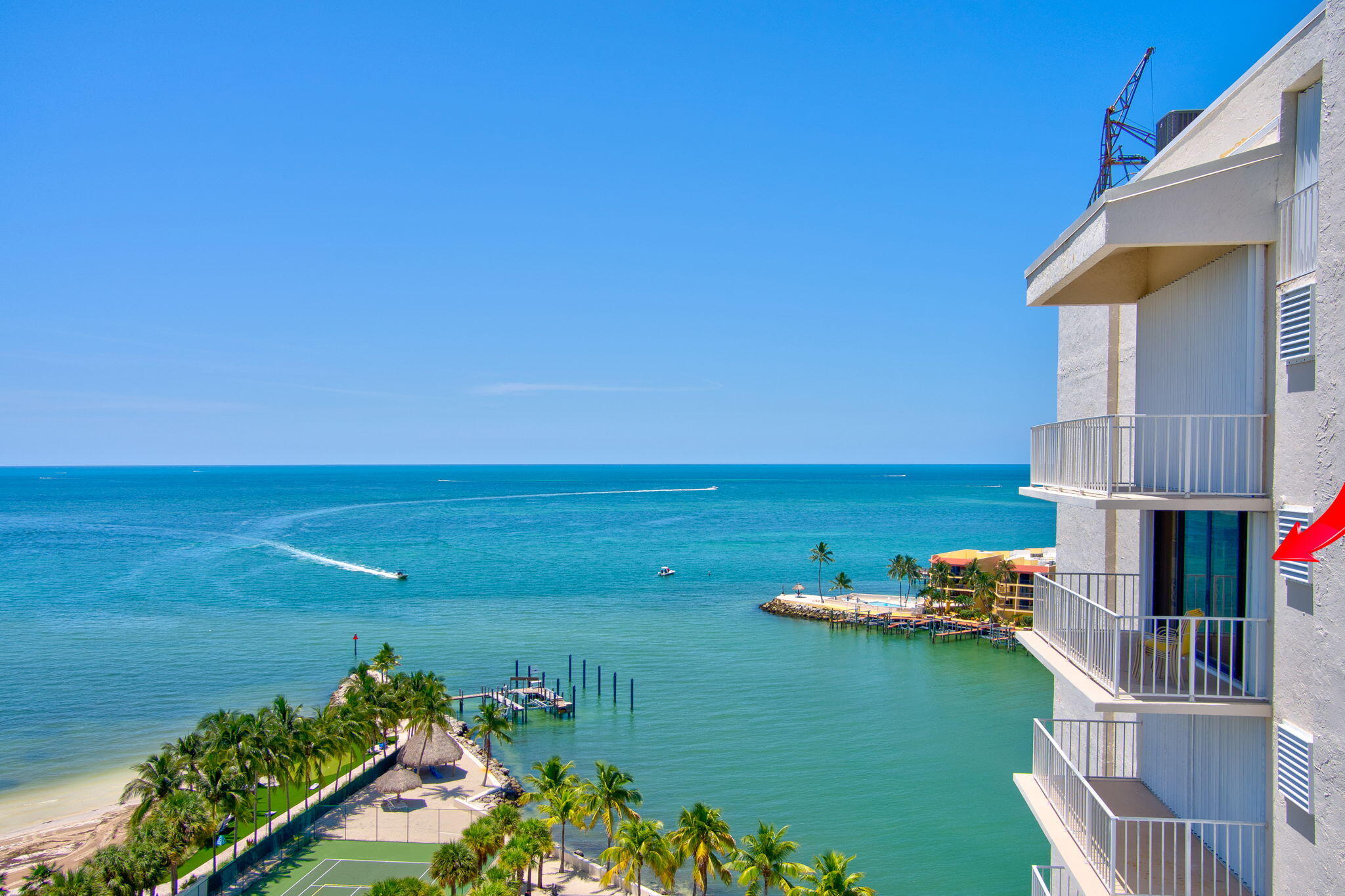 2000 Coco Plum Drive, Unit 1202 Marathon, FL 33050 - Photo 3 of 44 a view of a house with a ocean view