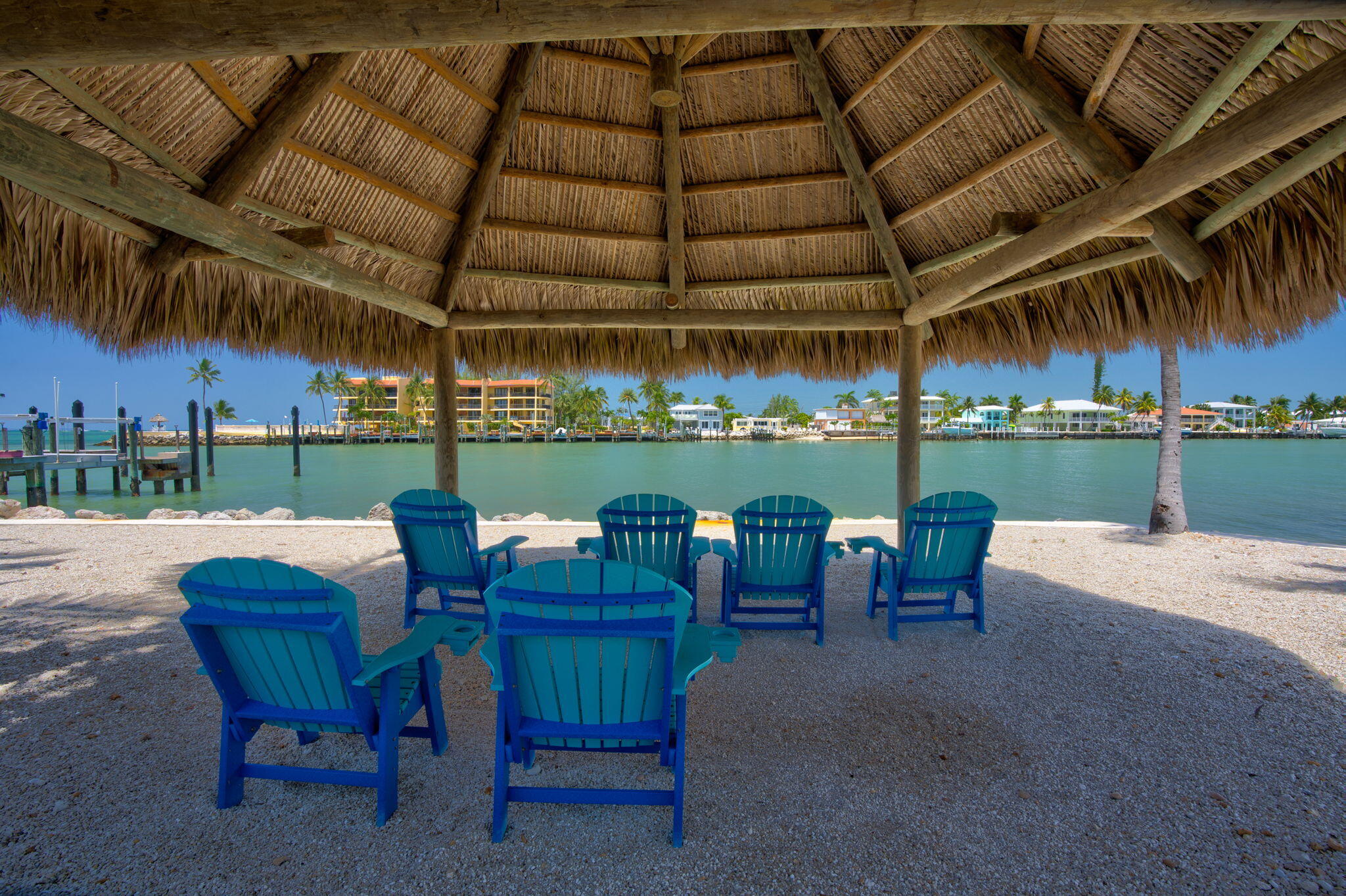 2000 Coco Plum Drive, Unit 1202 Marathon, FL 33050 - Photo 34 of 44 a view of a big yard with table and chairs in patio