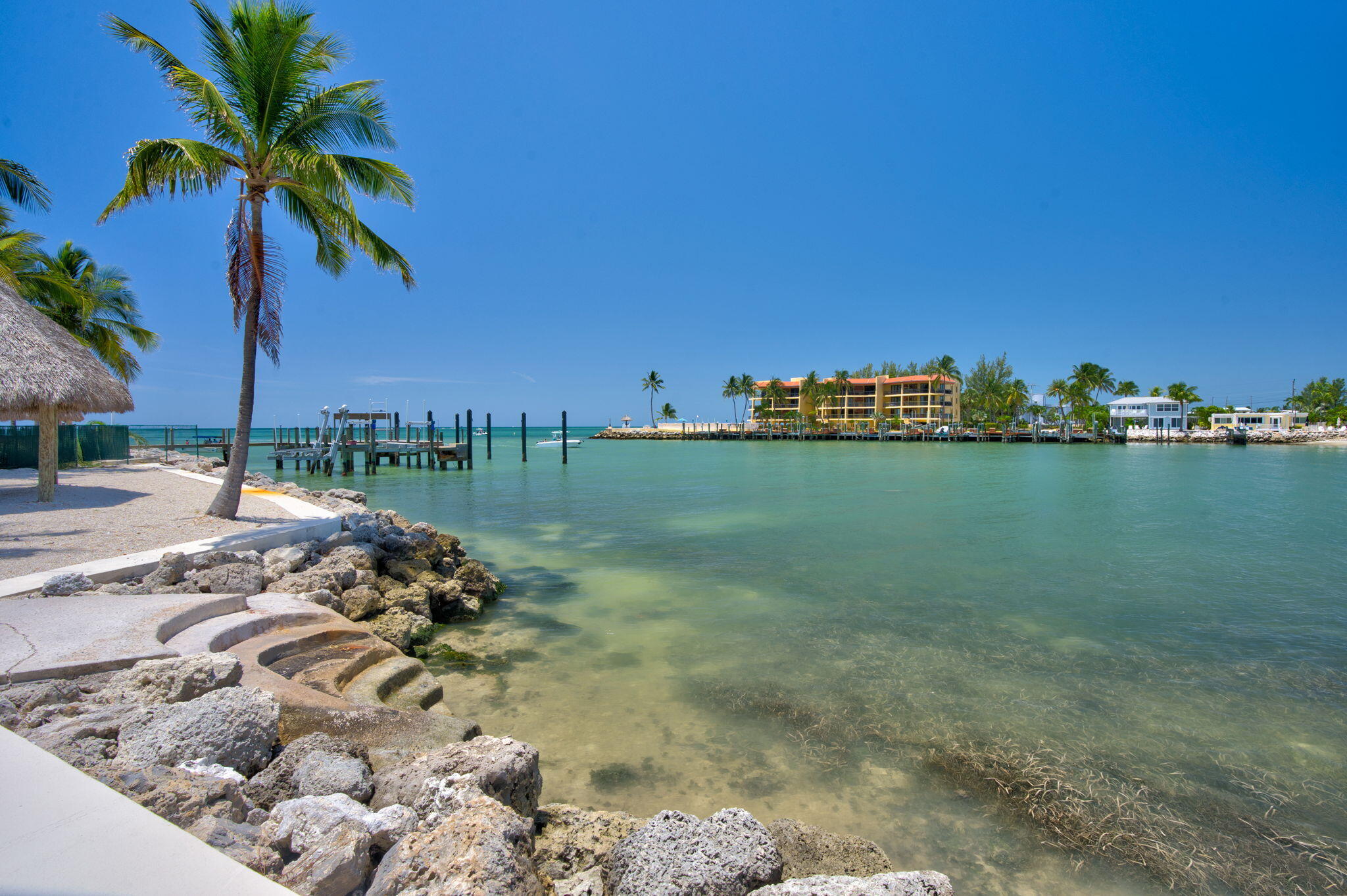 2000 Coco Plum Drive, Unit 1202 Marathon, FL 33050 - Photo 36 of 44 a view of a lake with a big yard