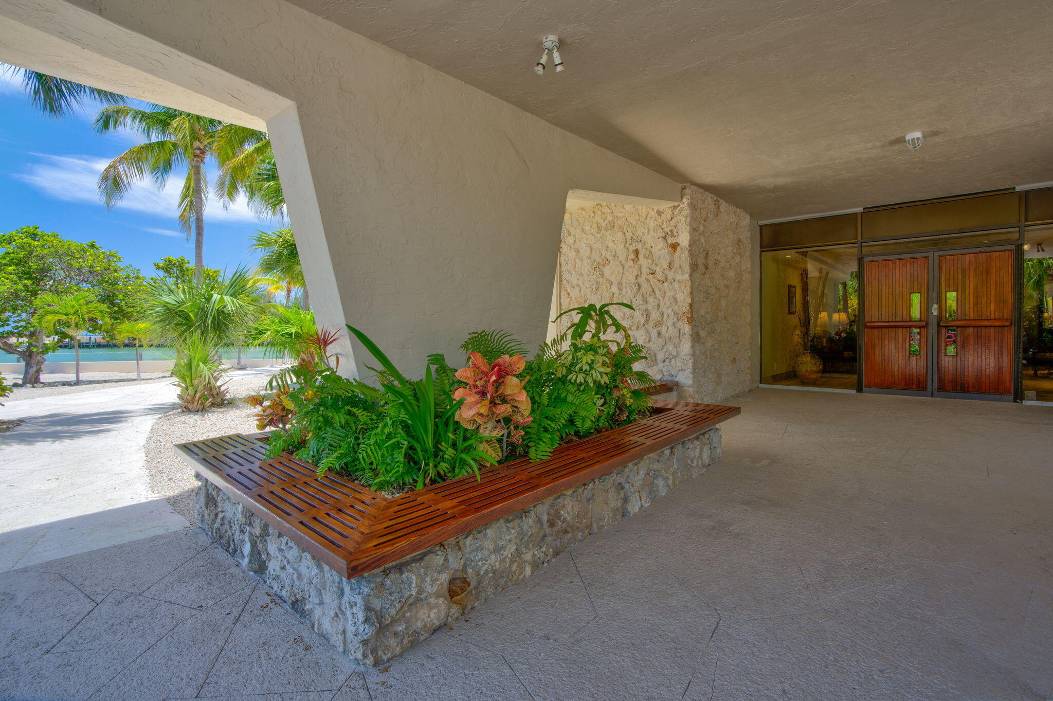 2000 Coco Plum Drive, Unit 1202 Marathon, FL 33050 - Photo 37 of 44 a living room with furniture and a potted plant
