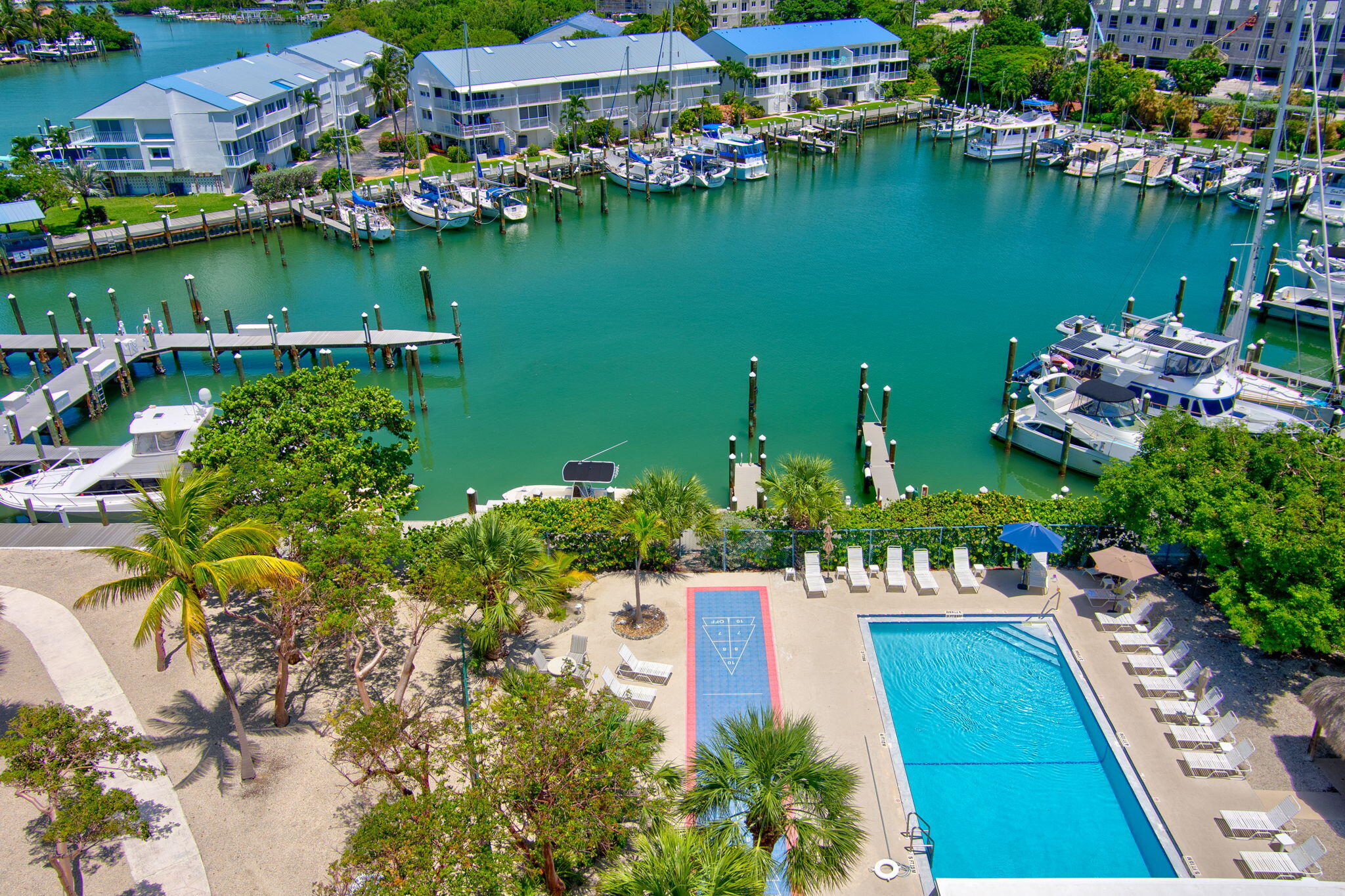 2000 Coco Plum Drive, Unit 1202 Marathon, FL 33050 - Photo 39 of 44 an aerial view of a houses with a lake view