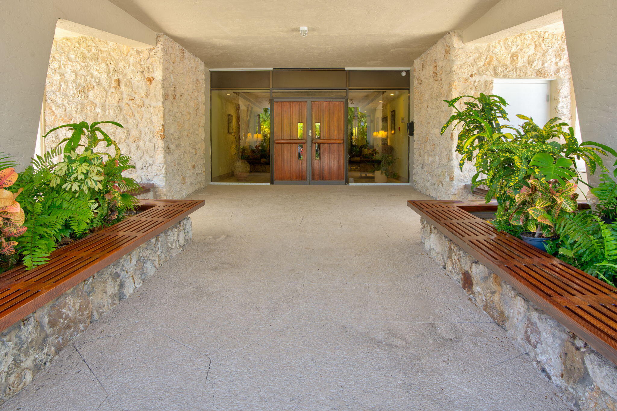 2000 Coco Plum Drive, Unit 1202 Marathon, FL 33050 - Photo 5 of 44 a large room with potted plants