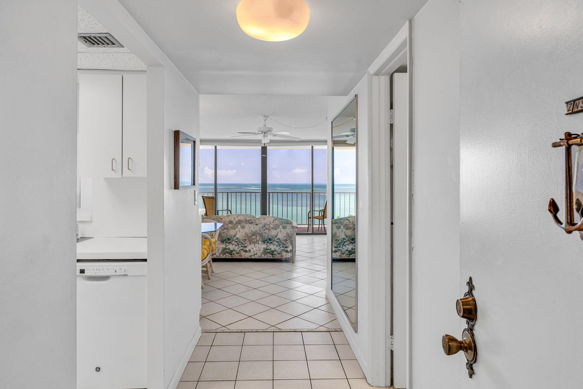 2000 Coco Plum Drive, Unit 1202 Marathon, FL 33050 - Photo 6 of 44 a bedroom with a bed and a window