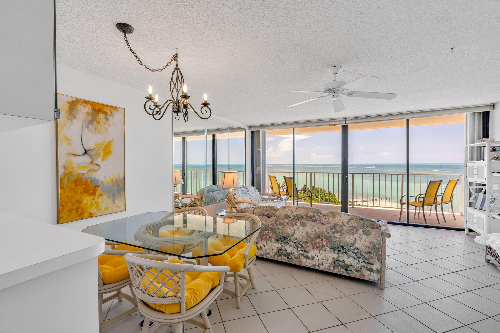 2000 Coco Plum Drive, Unit 1202 Marathon, FL 33050 - Photo 7 of 44 a living room with furniture and a floor to ceiling window