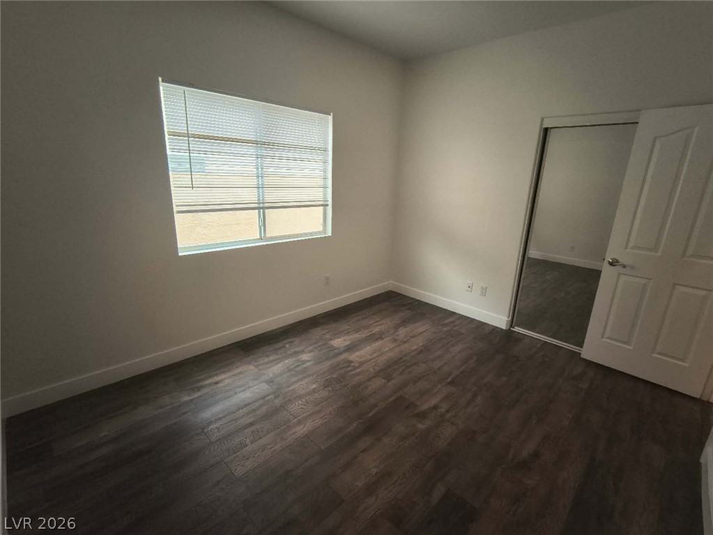 9725 Pima Point Avenue Las Vegas, NV 89147 - Photo 24 of 35 Laminate flooring and a bright window create an inviting, adaptable space.