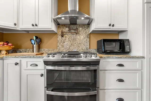 a view of a hallway with wooden floor and closet