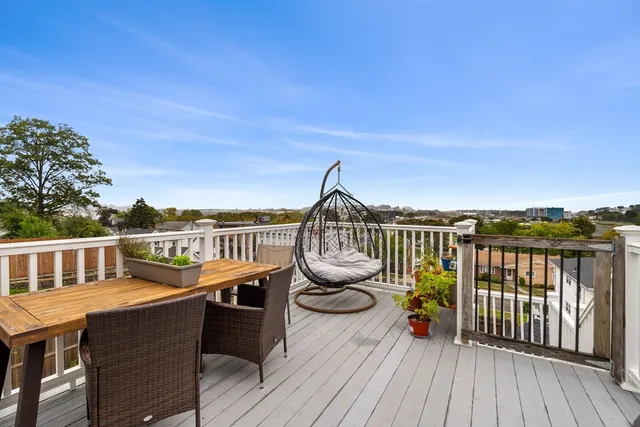 a bedroom with a bed couch and window