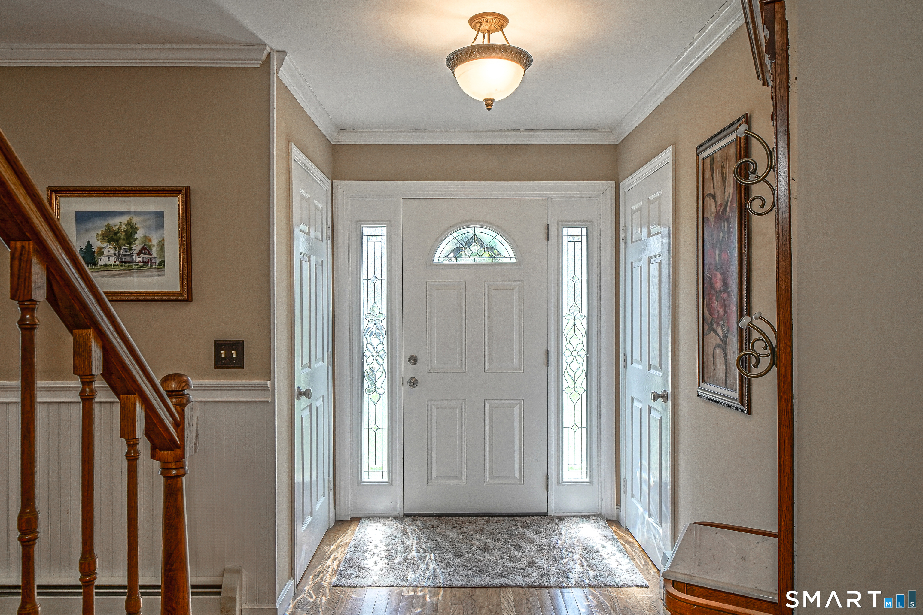 20 Stephen Court Prospect, CT 06712 - Photo 16 of 39 Wood floors and double guest closets in the foyer. Waincoting on a half wall.