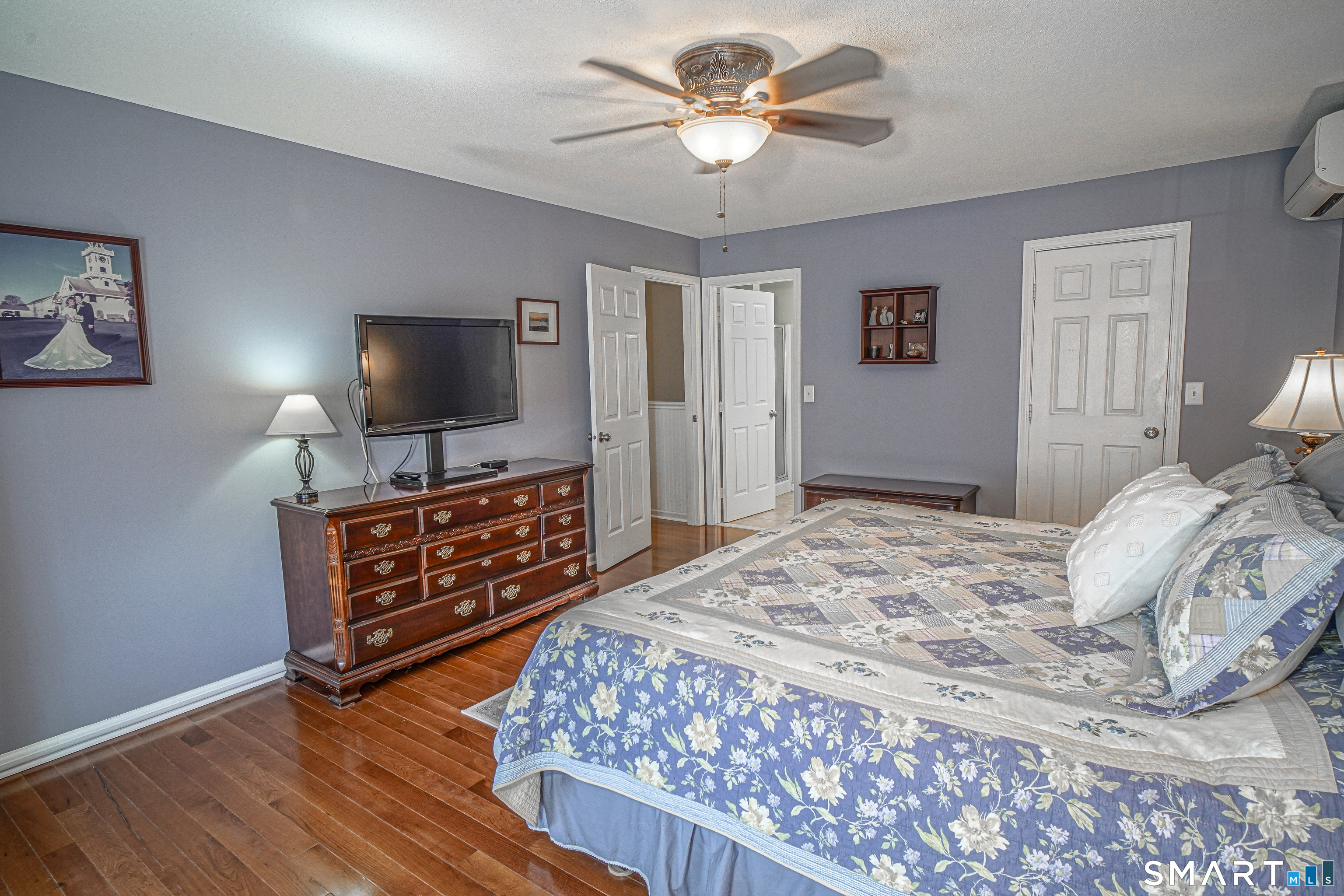20 Stephen Court Prospect, CT 06712 - Photo 19 of 39 Primary bedroom with full bath, walk-in closet, and ceiling fan.