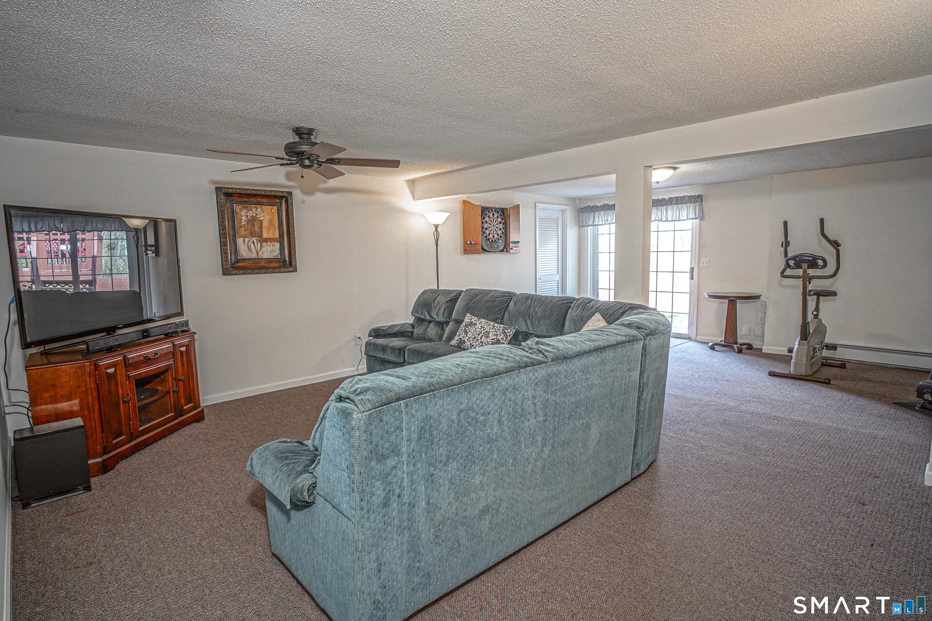 20 Stephen Court Prospect, CT 06712 - Photo 27 of 39 The lower-level family room features sliding doors that open to the backyard and pool.