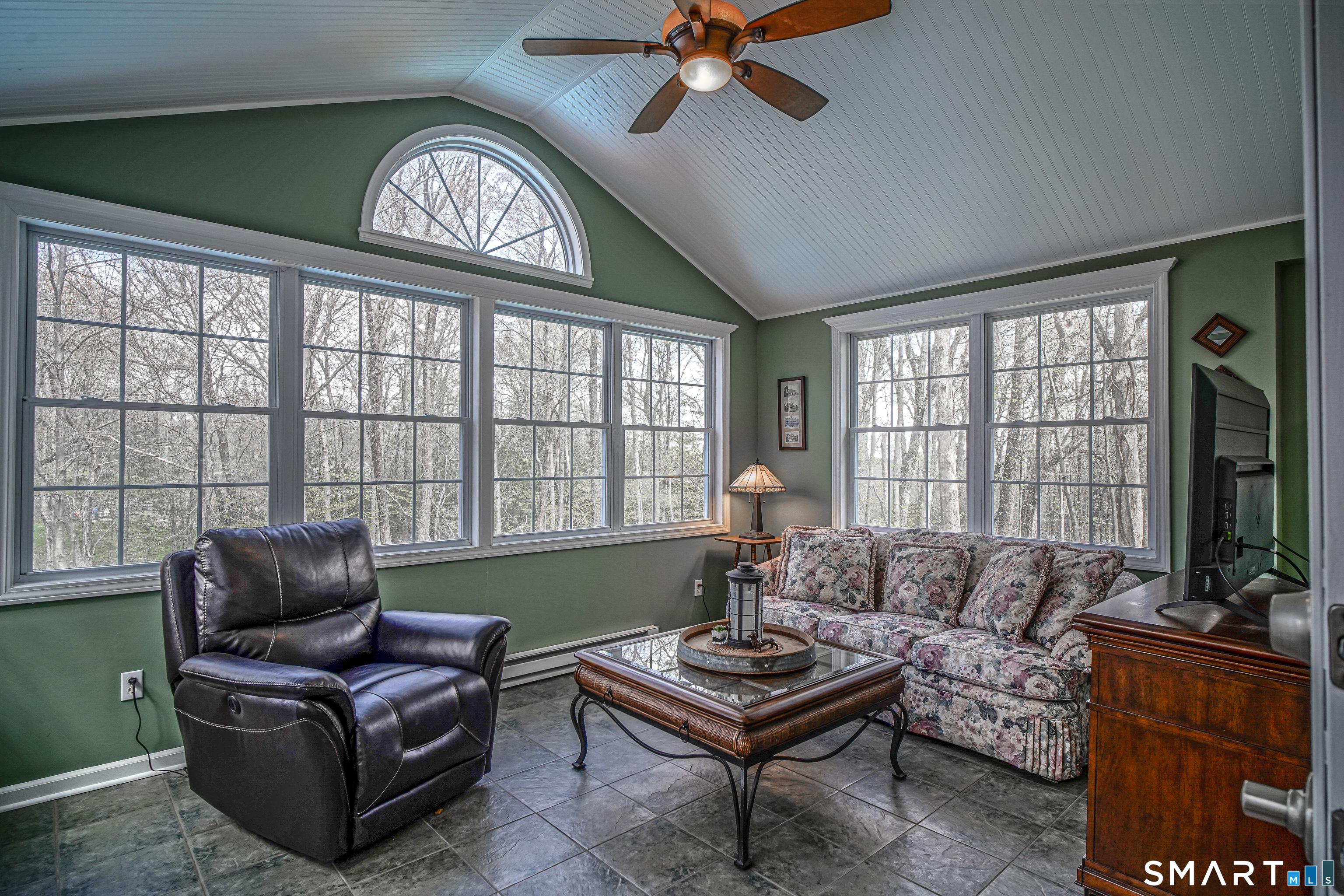 20 Stephen Court Prospect, CT 06712 - Photo 5 of 39 Relax in this birght 4 season room room with catheral ceiling and a paddle fan