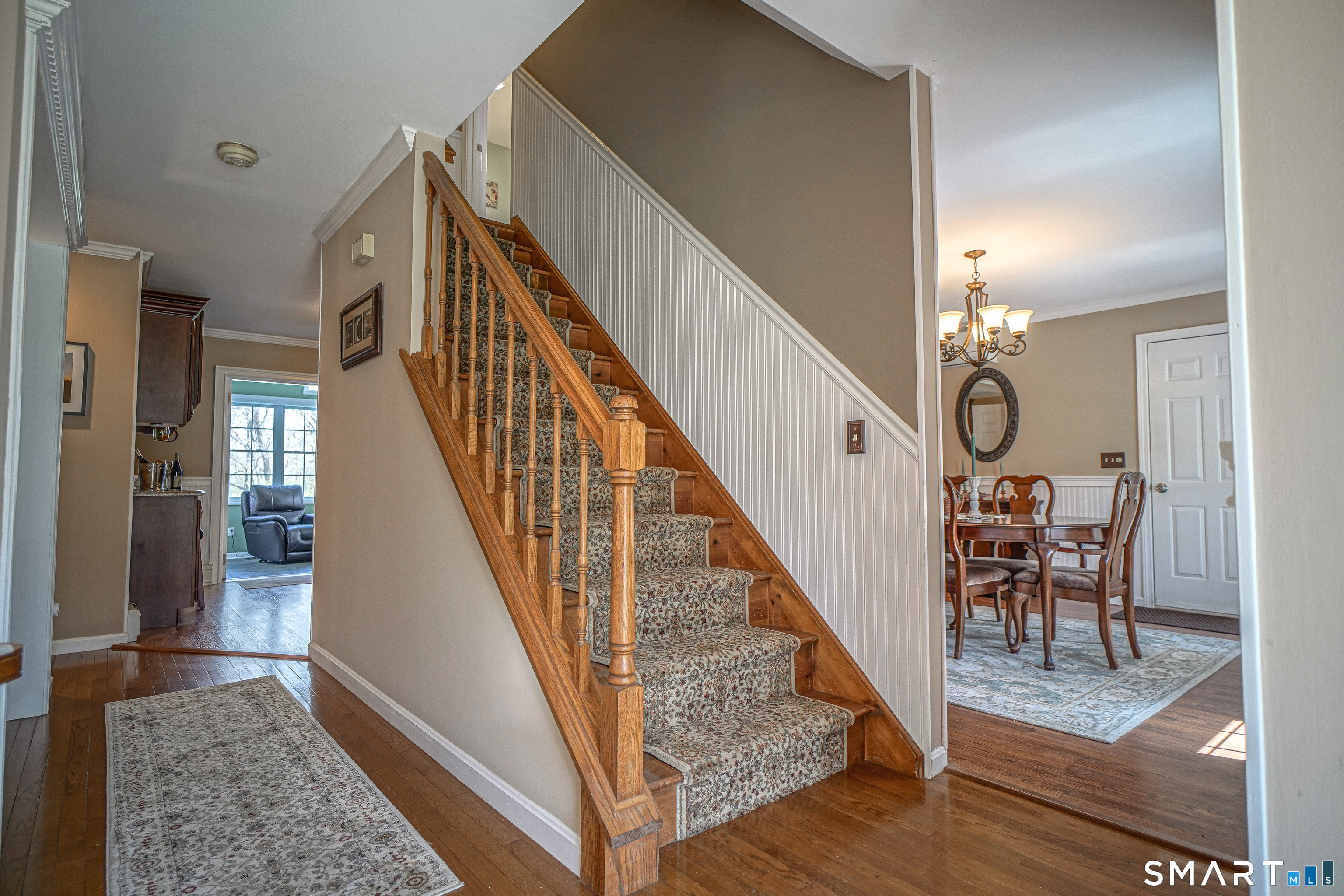 20 Stephen Court Prospect, CT 06712 - Photo 6 of 39 The stairway has decorative woodwork with wainscoting.