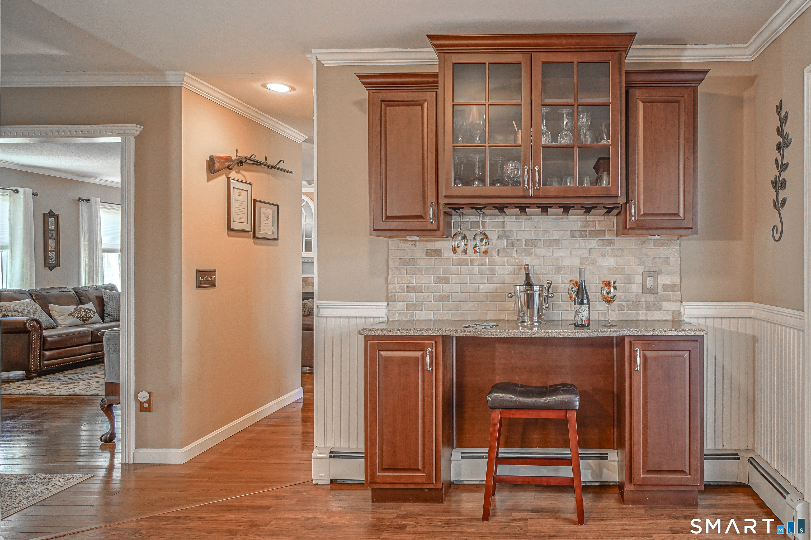 20 Stephen Court Prospect, CT 06712 - Photo 8 of 39 The remodeled kitchen includes a bar with additional cabinets.