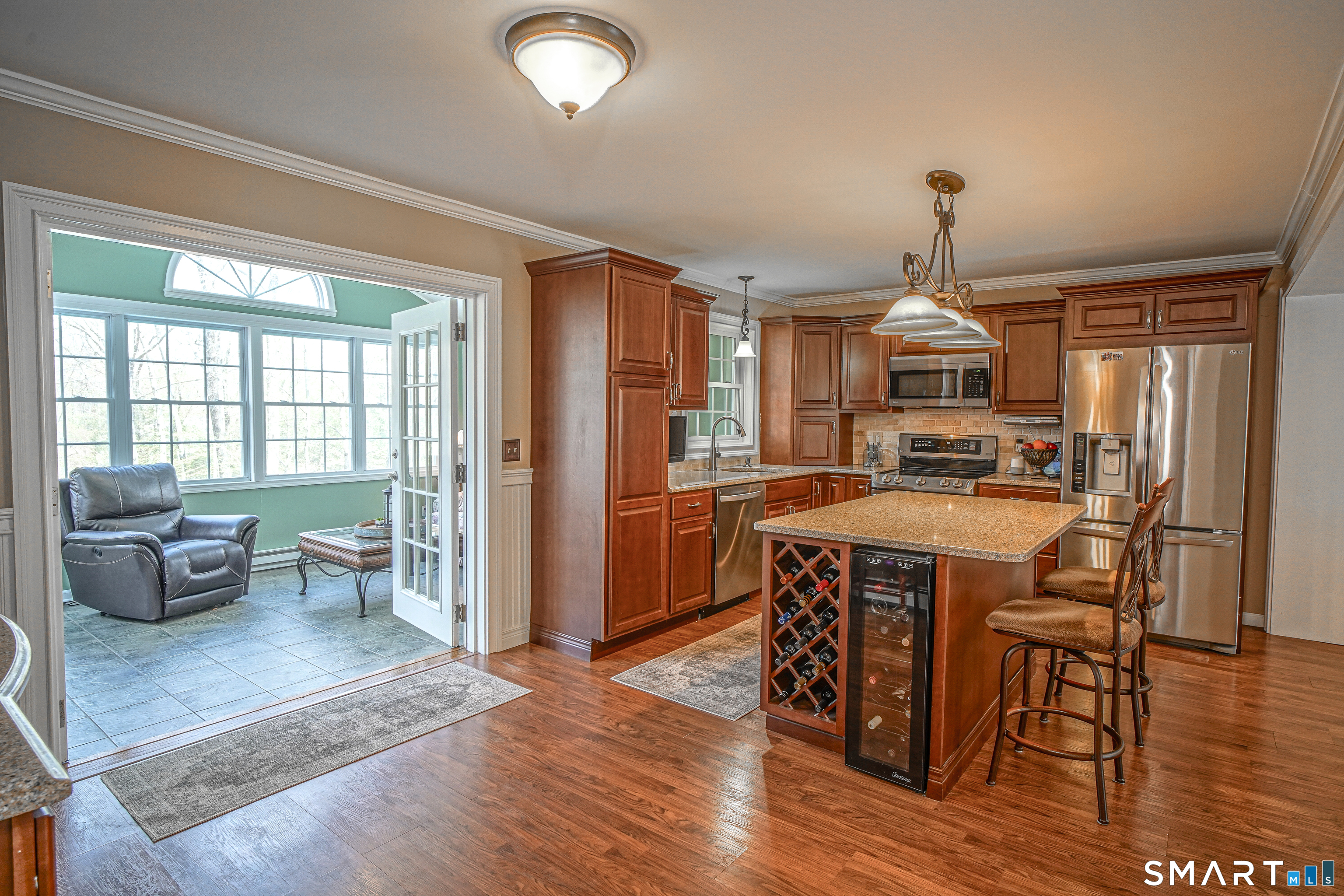 20 Stephen Court Prospect, CT 06712 - Photo 38 of 39 Open floor plan of kitchen to sunroom with French glass doors.