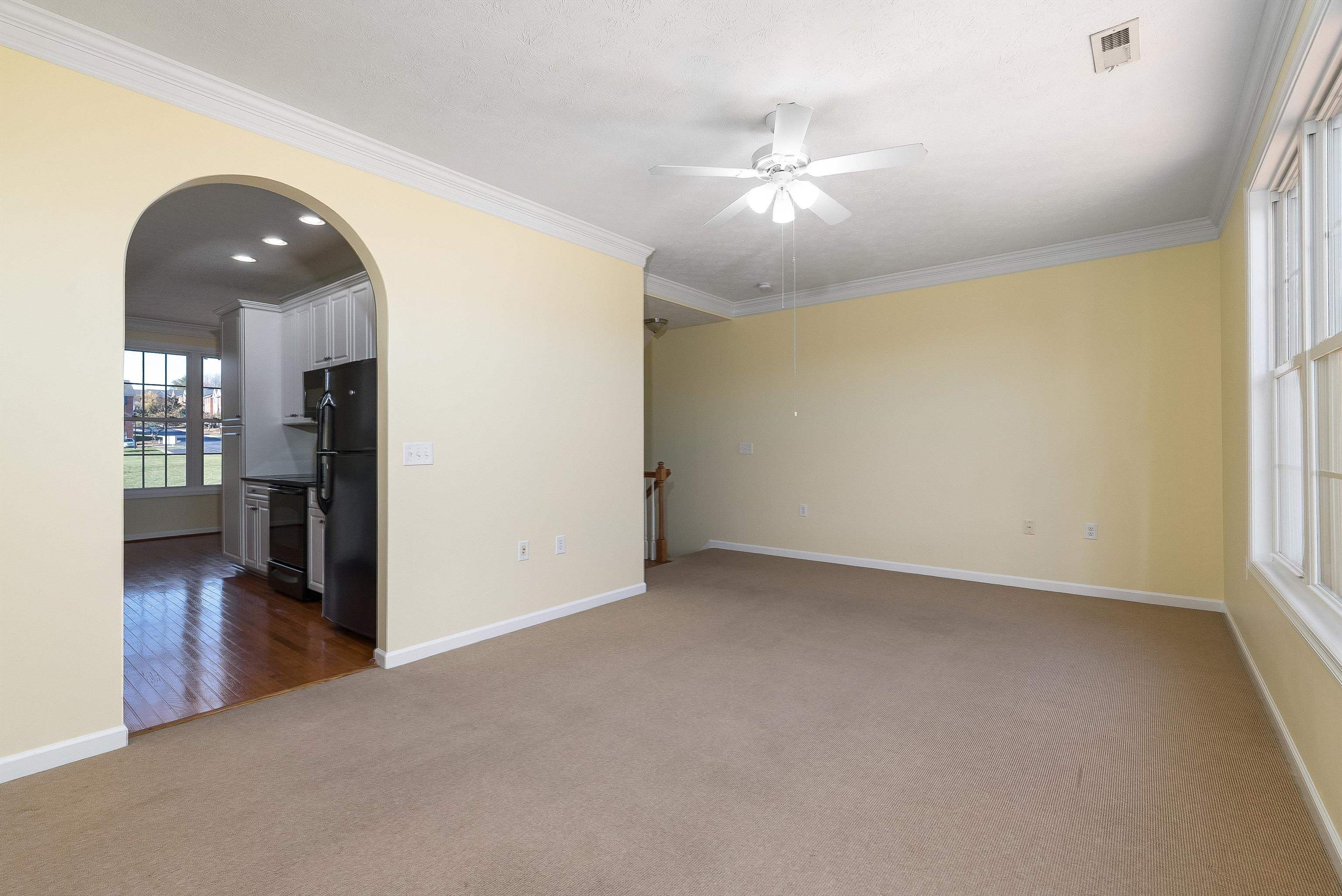 1439 Flowing Spring Lane Harrisonburg, VA 22801 - Photo 12 of 44 an empty room with wooden floor and windows