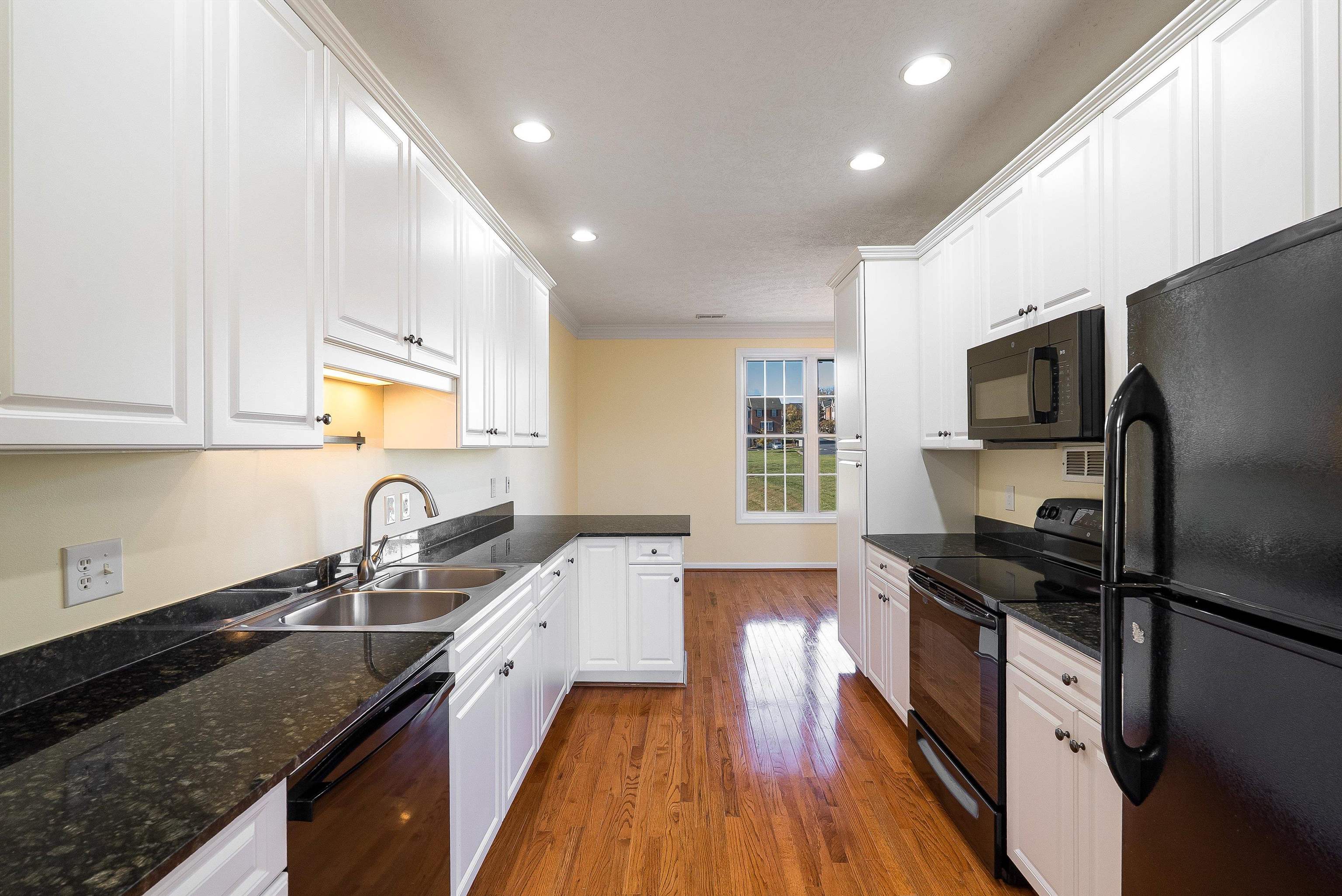 1439 Flowing Spring Lane Harrisonburg, VA 22801 - Photo 13 of 44 a kitchen with a sink appliances and cabinets