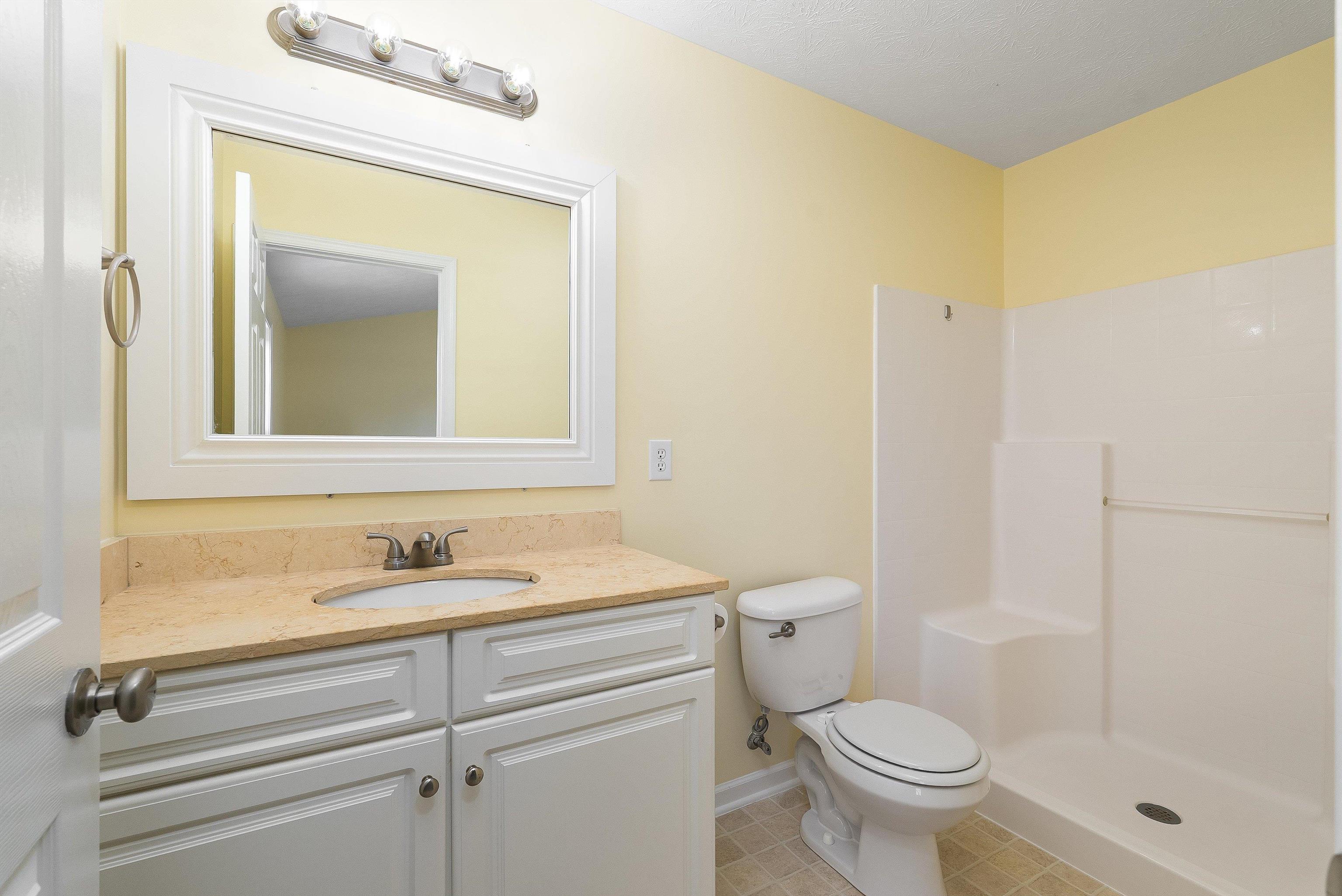 1439 Flowing Spring Lane Harrisonburg, VA 22801 - Photo 26 of 44 a bathroom with a sink toilet and shower