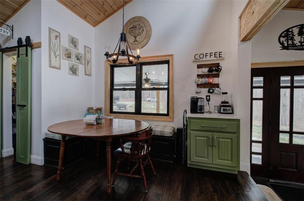 675 McGee Bend Road Southwest Cave Spring, GA 30124 - Photo 13 of 71 a view of a dining room with furniture and wooden floor
