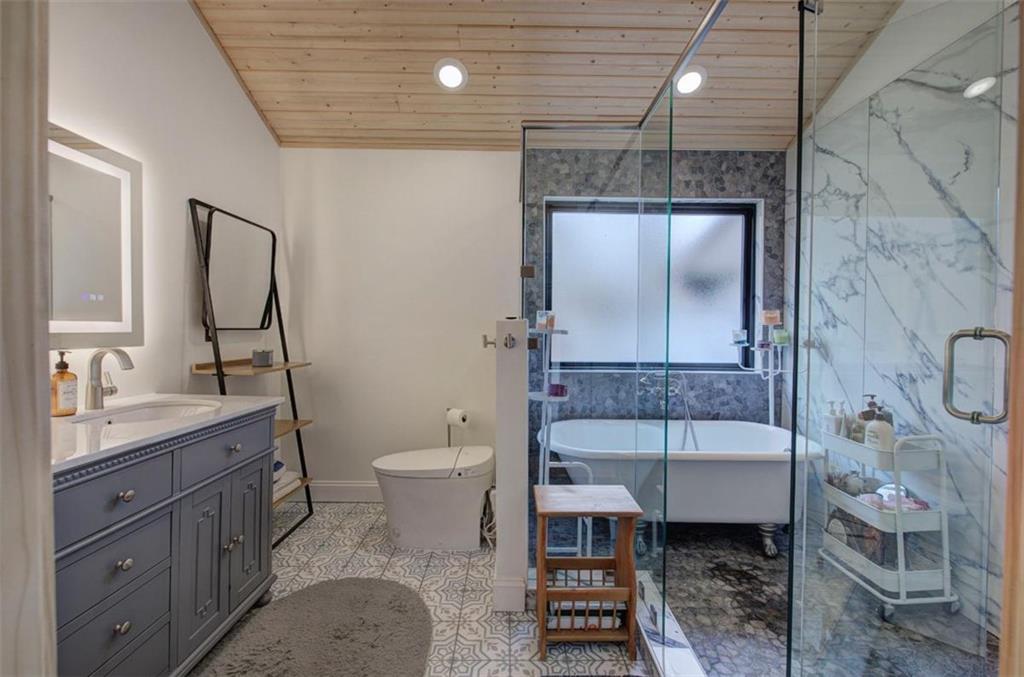 675 McGee Bend Road Southwest Cave Spring, GA 30124 - Photo 21 of 71 a bathroom with a sink toilet and shower