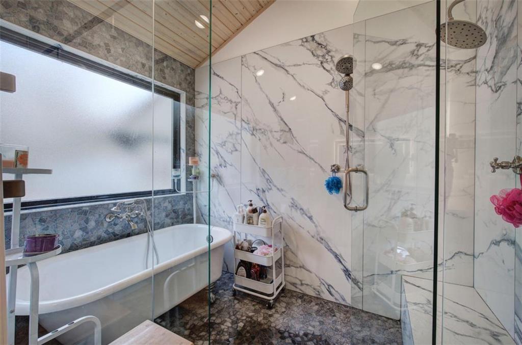 675 McGee Bend Road Southwest Cave Spring, GA 30124 - Photo 22 of 71 a bathroom with a bathtub and shower