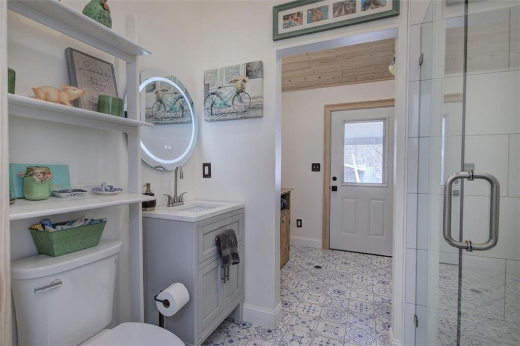 675 McGee Bend Road Southwest Cave Spring, GA 30124 - Photo 27 of 71 a bathroom with a sink a toilet and shower
