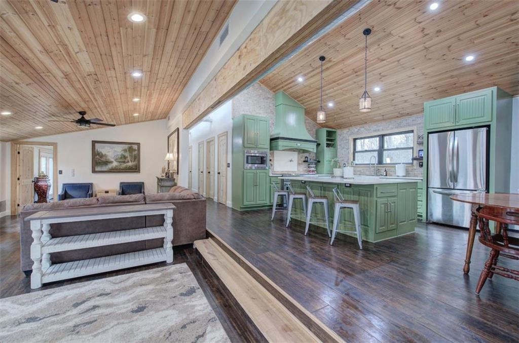 675 McGee Bend Road Southwest Cave Spring, GA 30124 - Photo 3 of 71 a dining room with furniture and a wooden floor