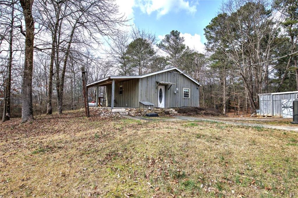675 McGee Bend Road Southwest Cave Spring, GA 30124 - Photo 47 of 71 a house with trees in the background