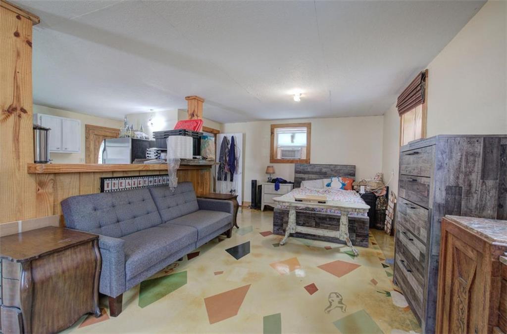675 McGee Bend Road Southwest Cave Spring, GA 30124 - Photo 50 of 71 a living room with furniture and a fireplace