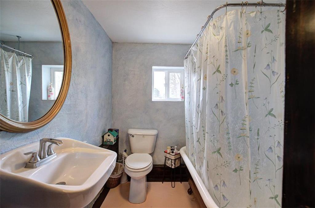 675 McGee Bend Road Southwest Cave Spring, GA 30124 - Photo 58 of 71 a bathroom with a toilet sink and shower