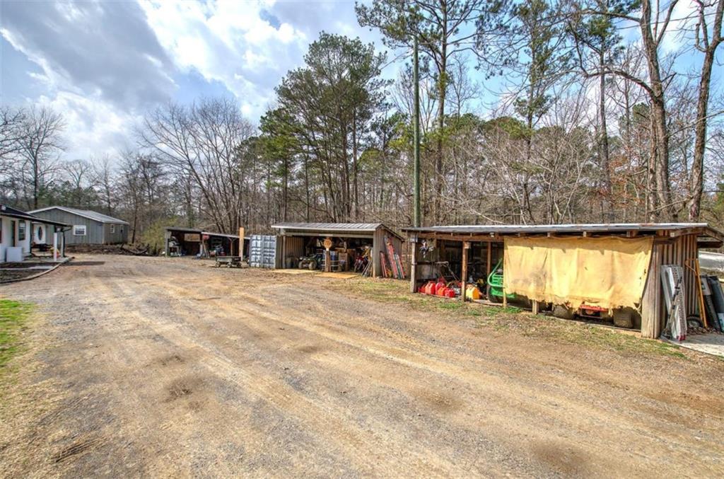 675 McGee Bend Road Southwest Cave Spring, GA 30124 - Photo 59 of 71 a view of a house with snow on the road and trees