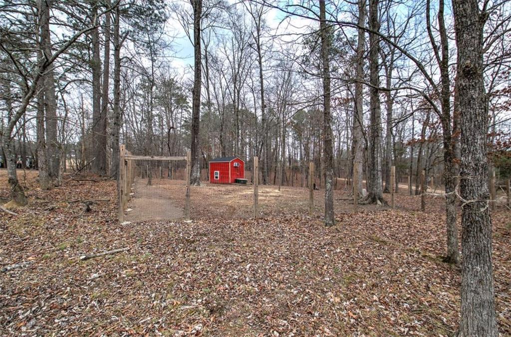 675 McGee Bend Road Southwest Cave Spring, GA 30124 - Photo 61 of 71 a flag is sitting in the middle of forest