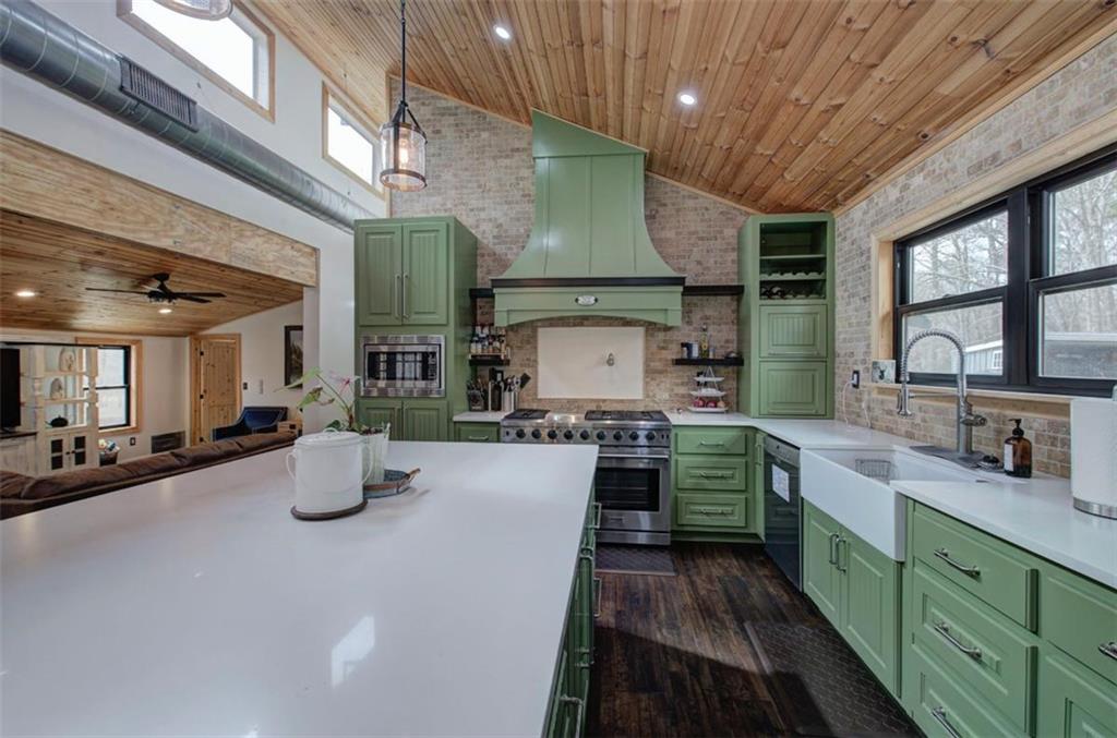 675 McGee Bend Road Southwest Cave Spring, GA 30124 - Photo 7 of 71 a kitchen with sink a stove and cabinets