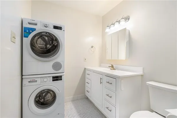 a bathroom with a sink a vanity and a mirror