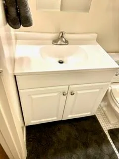 a view of a room with table and chairs