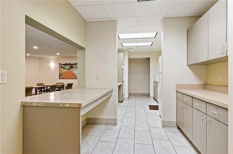 307 South Dithridge Street, Unit 11 Pittsburgh, PA 15213 - Photo 33 of 33 a kitchen with a sink dishwasher stove top oven and cabinets
