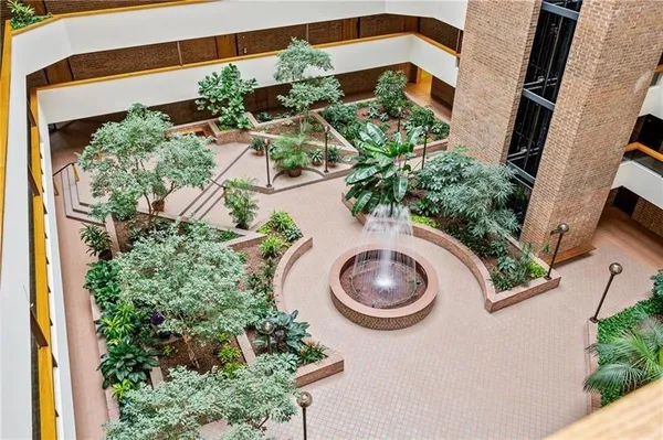 an aerial view of a house with outdoor space and sitting area