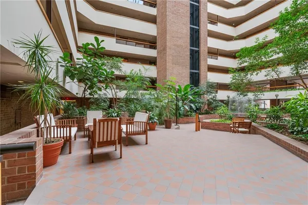 a view of a chairs and table in the patio