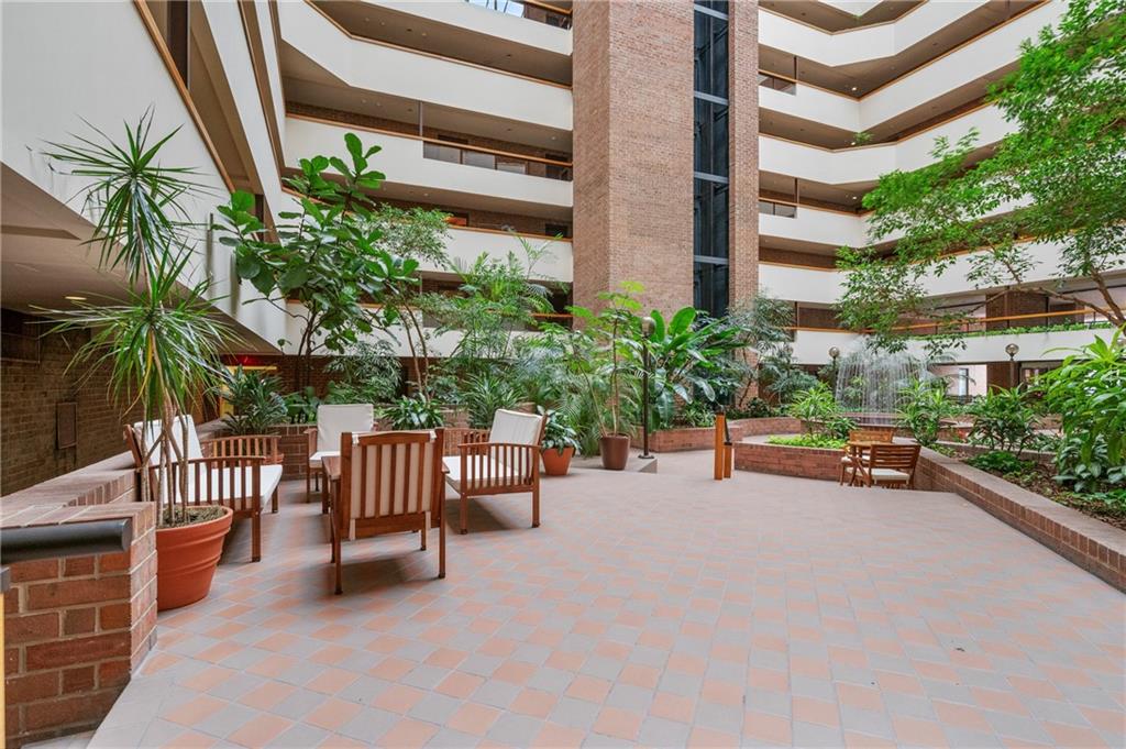 307 South Dithridge Street, Unit 11 Pittsburgh, PA 15213 - Photo 6 of 33 a view of a patio with a table and chairs and potted plants