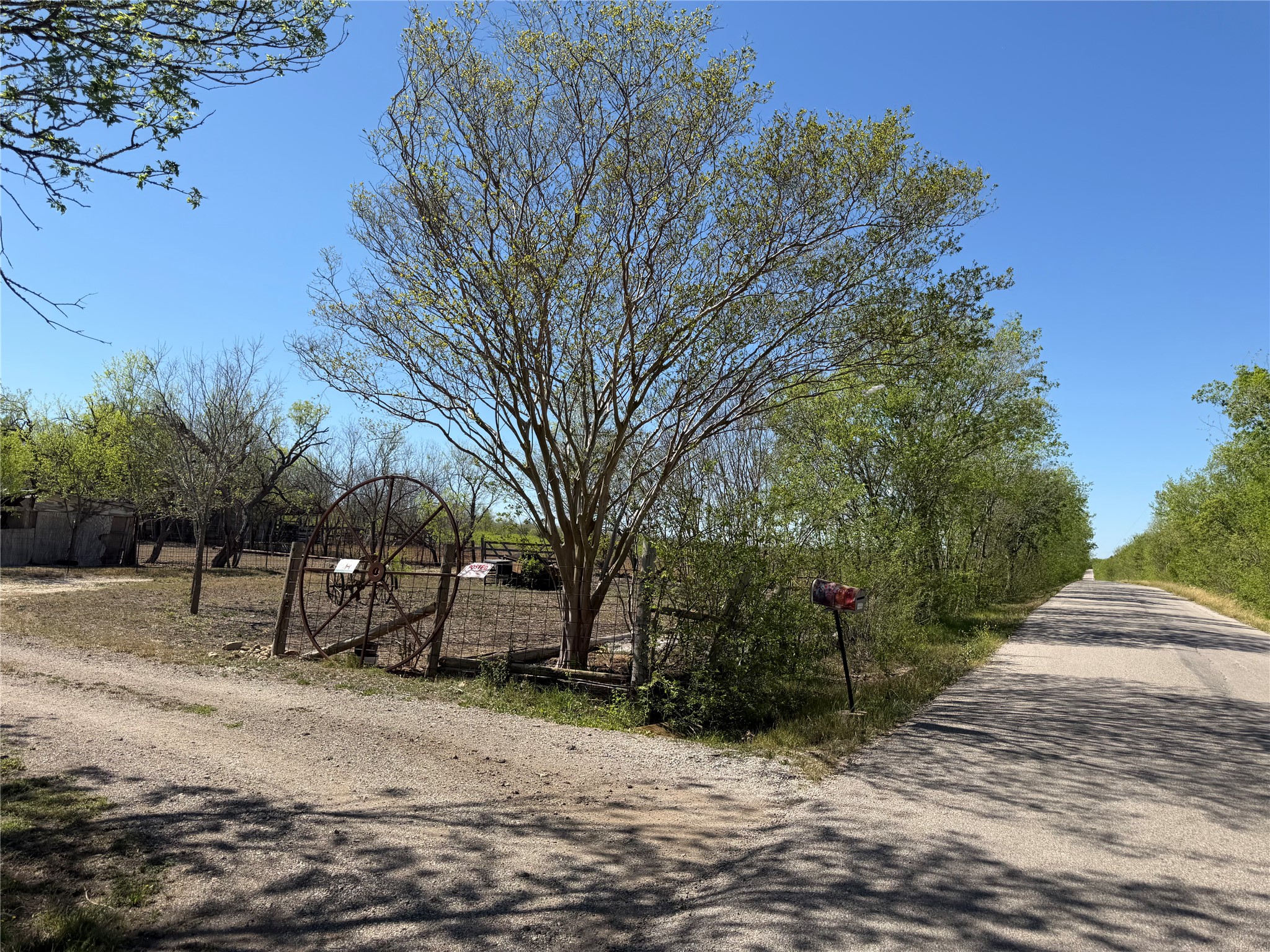 12129 Glass Road, Unit 3 Buda, TX 78610 - Photo 1 of 9 a view of a park with a bench