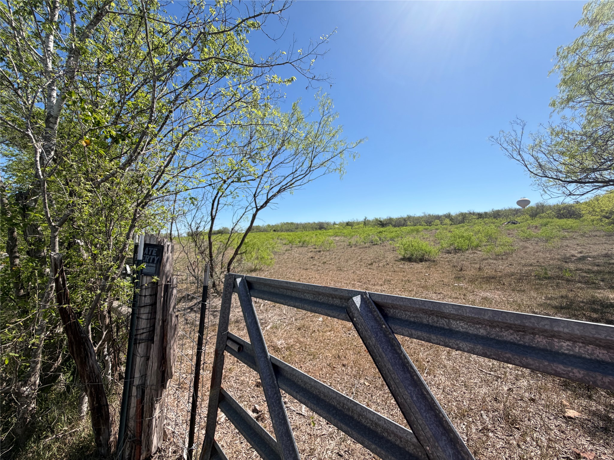 12129 Glass Road, Unit 3 Buda, TX 78610 - Photo 4 of 9 a view of balcony with wooden floor and fence