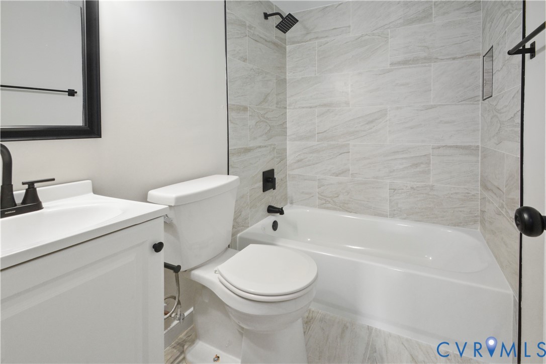 33 Waterfall Road Henrico, VA 23228 - Photo 11 of 16 White vanity with integrated sink, black hardware,