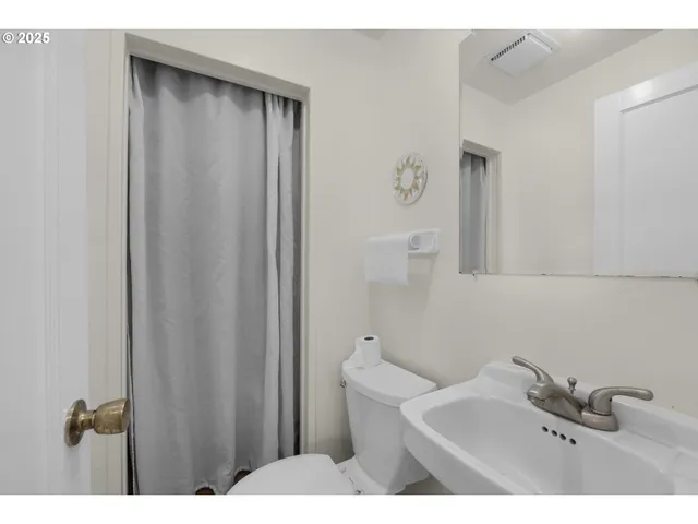 a bathroom with a sink and mirror