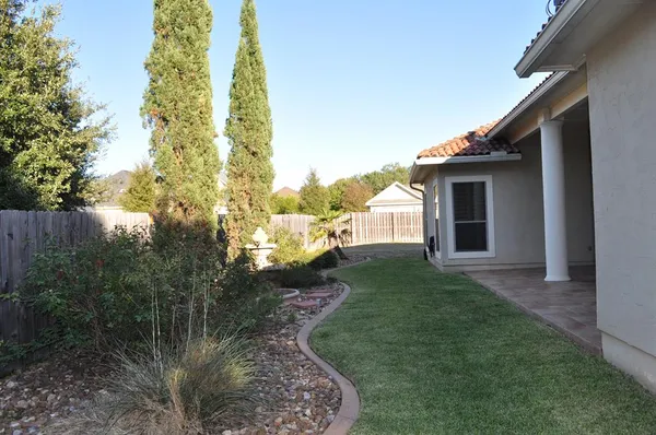 a backyard of a house with lots of green space