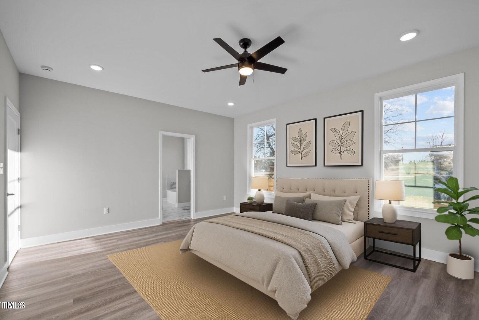 1101 Ridge Road Roxboro, NC 27573 - Photo 14 of 44 a bedroom with a large bed chandelier and a window