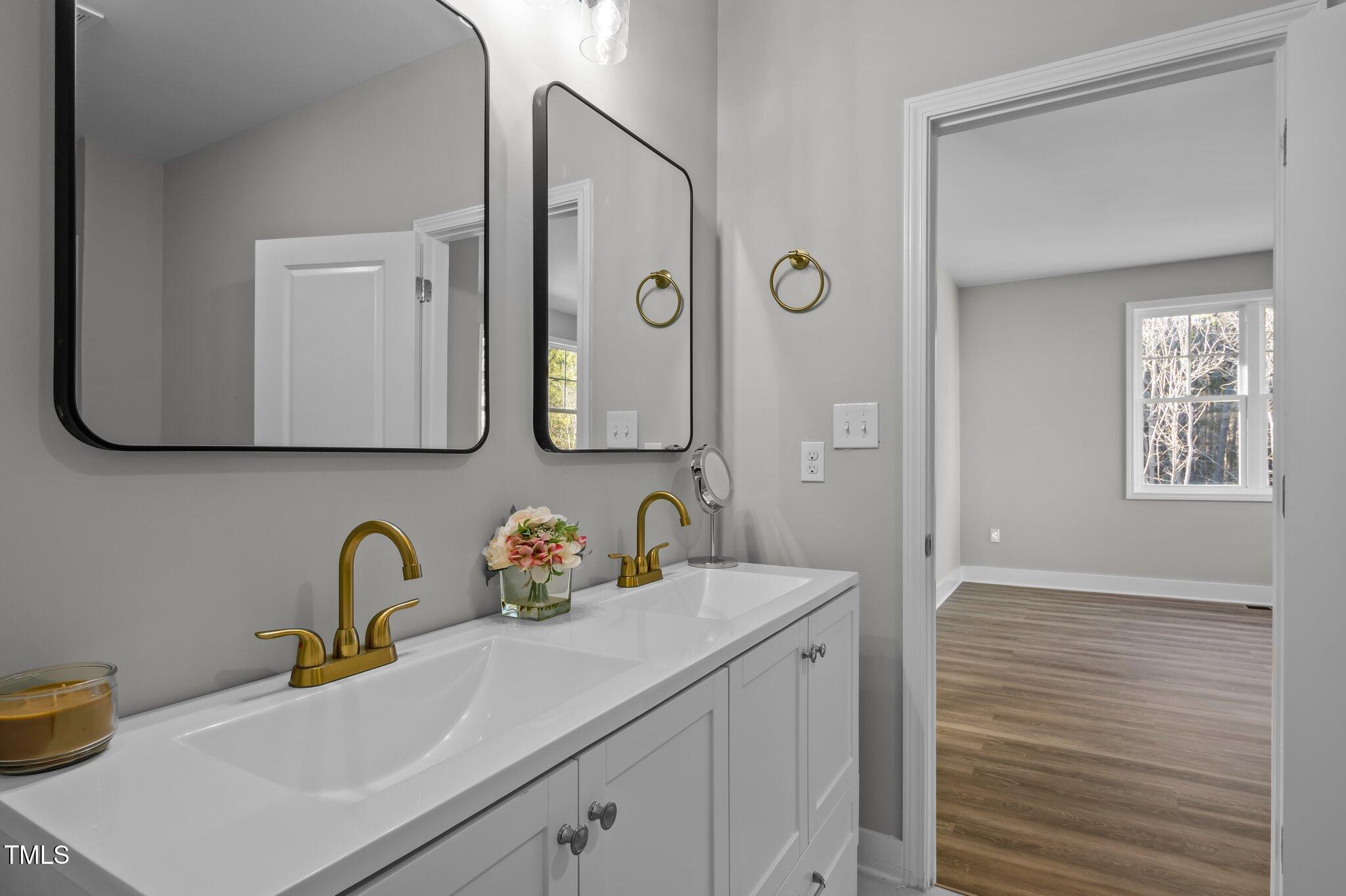 1101 Ridge Road Roxboro, NC 27573 - Photo 25 of 44 a bathroom with a sink and a mirror