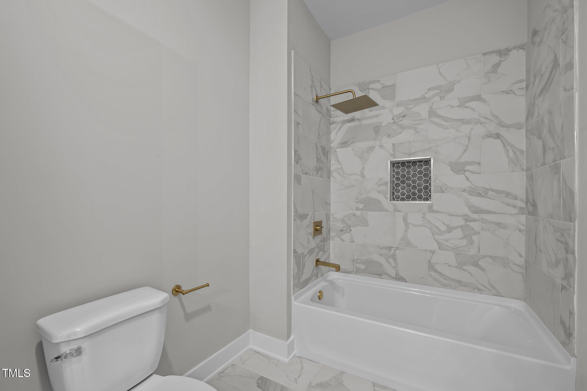 1101 Ridge Road Roxboro, NC 27573 - Photo 26 of 44 a bath room with a toilet sink and shower
