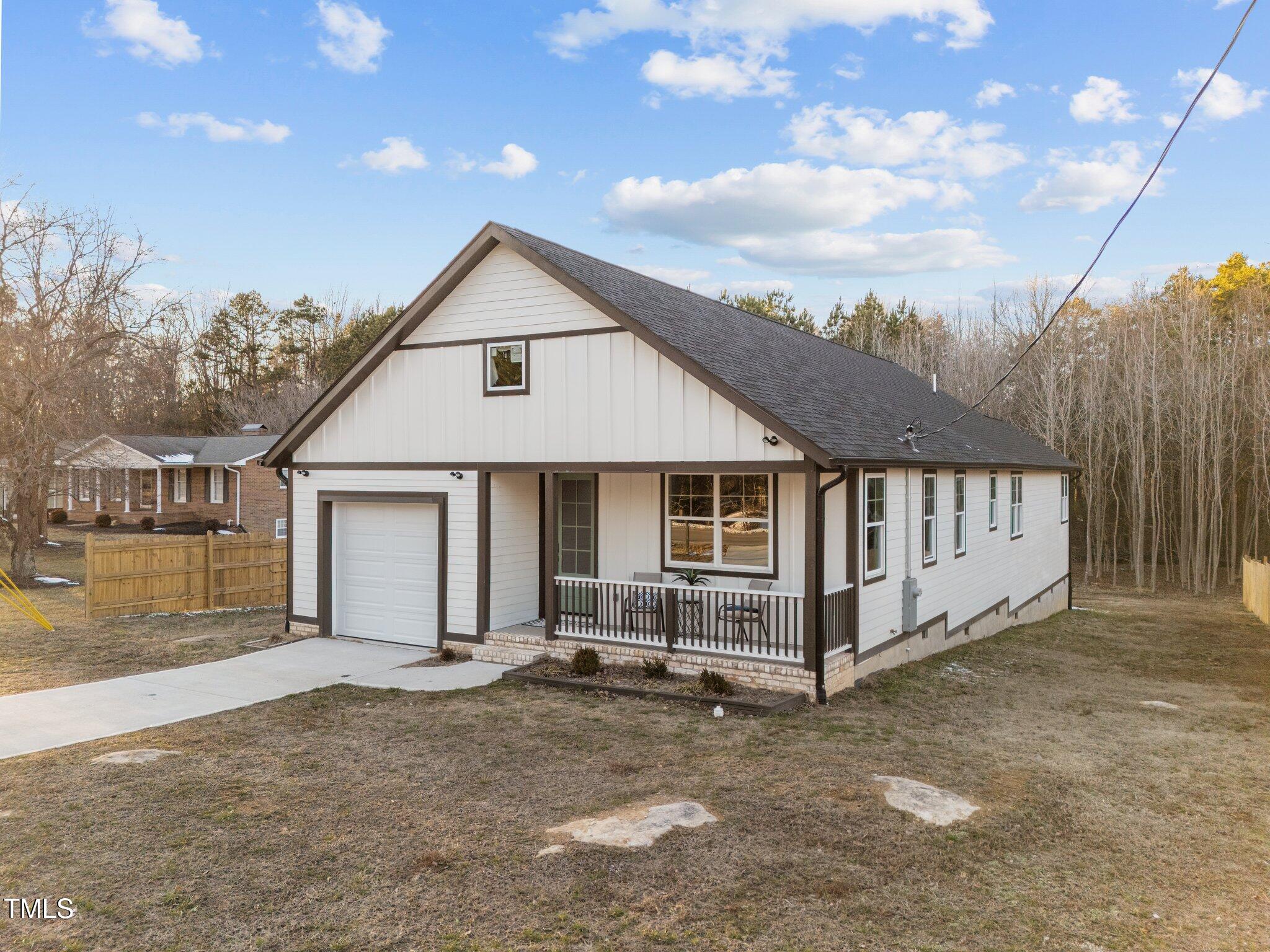 1101 Ridge Road Roxboro, NC 27573 - Photo 41 of 44 a view of a house with a yard and wooden fence