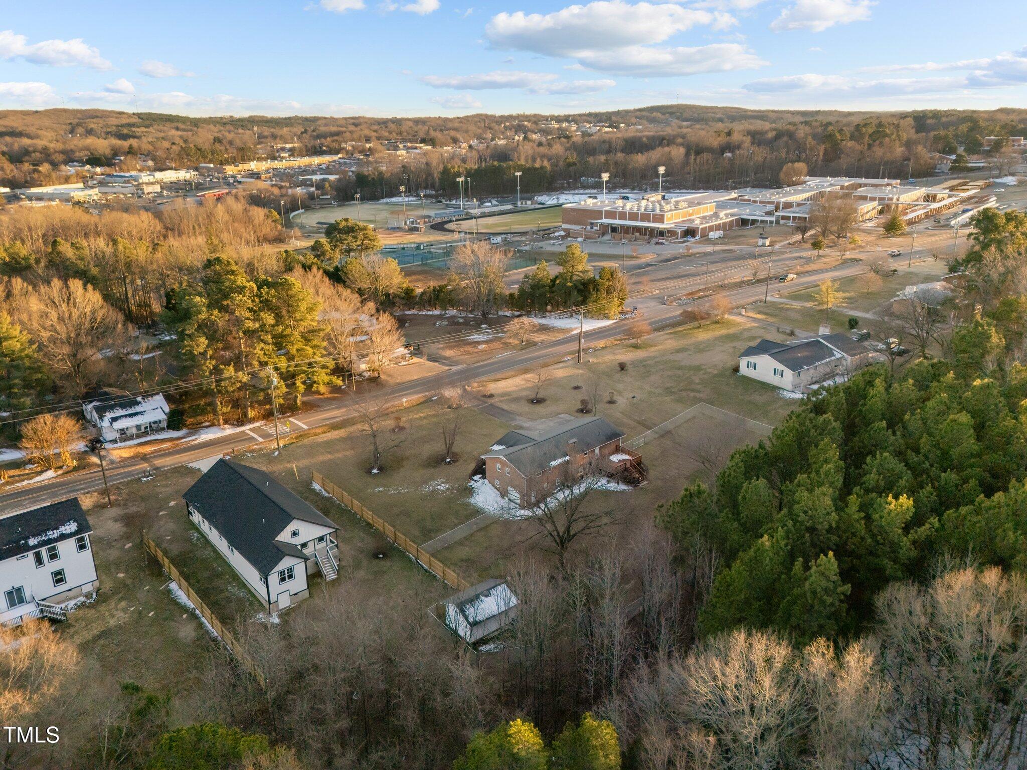 1101 Ridge Road Roxboro, NC 27573 - Photo 42 of 44 an aerial view of residential houses with outdoor space